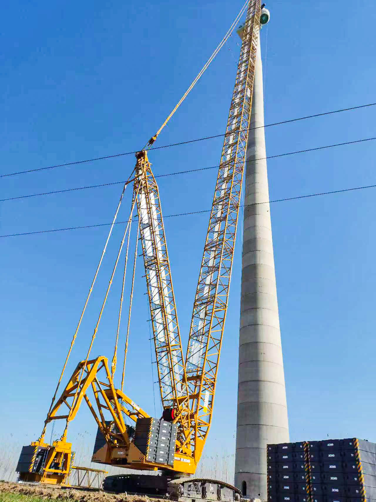 160米高空精准“搭积木”：豪利777XLC15000M分体吊装6.25兆瓦风机全纪录